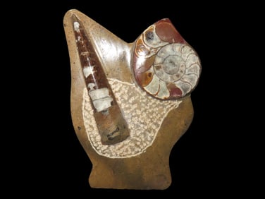 Fossilized Rock Figurine with Shell Inlays