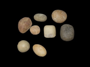 Group of worn Stone Game Pcs.