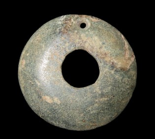 Maya Ear Spool, Central America. Greenstone, 1 inch wide. Ex Dr David Harner, Arkansas.