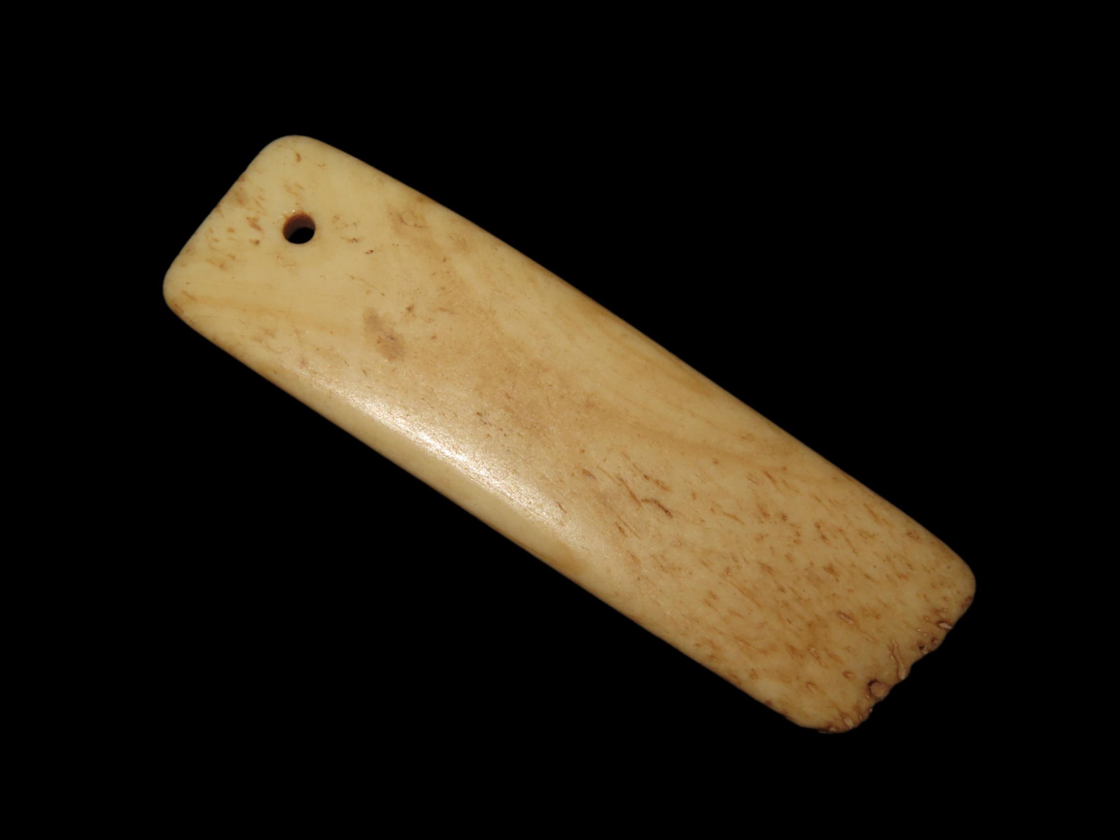 2 1/8" Bone Pendant found in South Dakota. Highly Polished Example, Mandan Culture, Circa: 2 1/8" Bone Pendant found in South Dakota. Highly Polished Example, Mandan Culture, Circa 1600-1700's