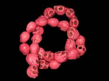 15" Stand of Pinkish Skull Beads