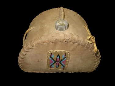 Antique Native American beaded hide canteen or water flask. It is made from tanned animal hide, poss