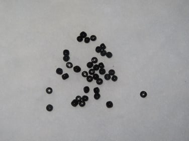 Selection of Small Black Glass Trade Beads Found in a Cache in Georgia