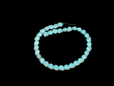 Strand of Turquoise Dyed Skull Beads