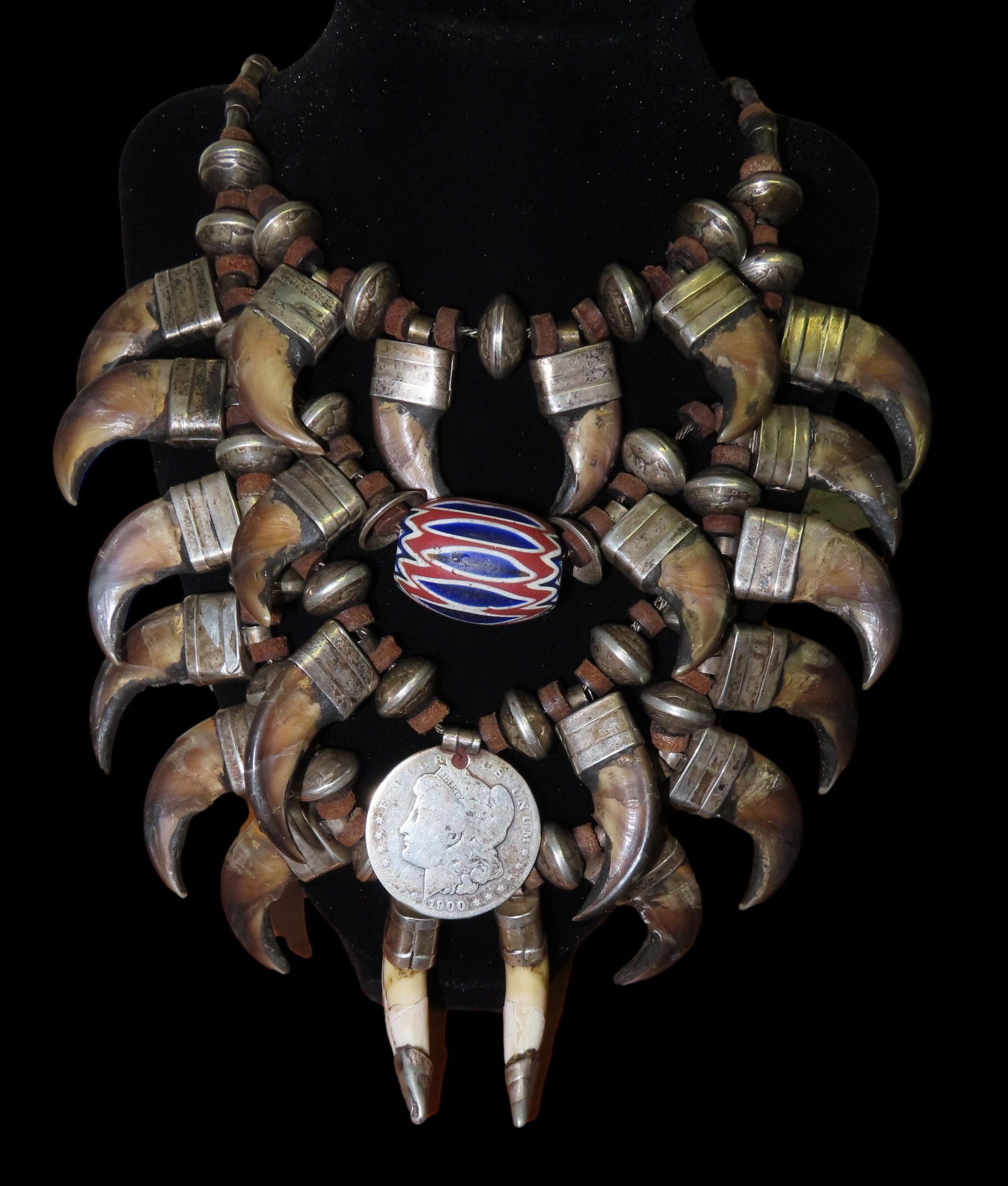 18" Massive & Ornate Grizzly Bear Claw Necklace- Heavy and Detailed, Centerpiece Pendants are a: 18" Massive & Ornate Grizzly Bear Claw Necklace- Heavy and Detailed, Centerpiece Pendants are a 1900 Morgan Silver Dollar- the back appears to have been "covered" over and a Star placed on it, along w