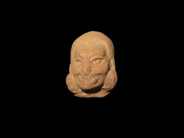 1 1/8" X 3/4" Pre-Columbian Mayan terracotta head, It dates from approximately 500-900 AD.