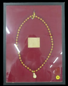 16 3/8" X 12 3/8" Frame Containing Gold-Capped Bull Elk Ivory Tooth Necklace Strung on Deerskin