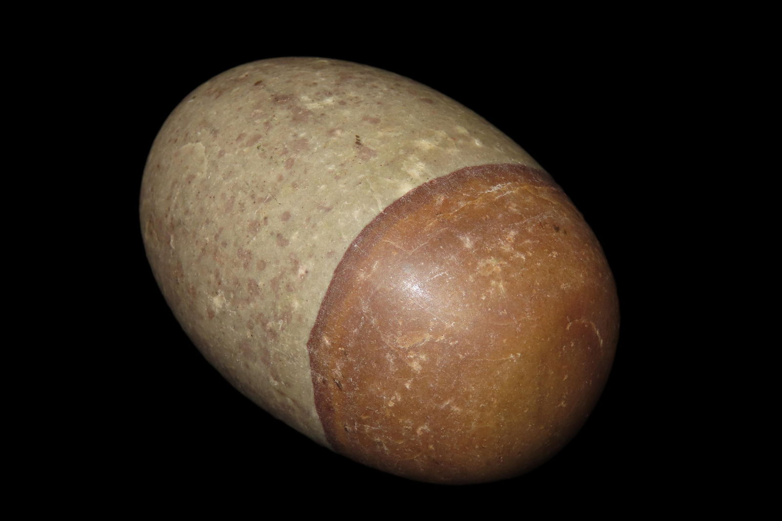 3 5/8" Shiva Lingam stone. It is a sacred, egg-shaped stone in Hinduism, representing the deity: 3 5/8" Shiva Lingam stone. It is a sacred, egg-shaped stone in Hinduism, representing the deity Shiva and the totality of existence. Authentic Shiva Lingams are found naturally only in the Narmada Riv