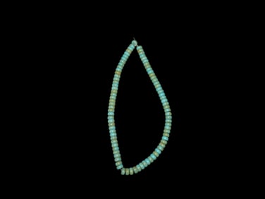 Strand Of Pressed Turquoise Disc Beads