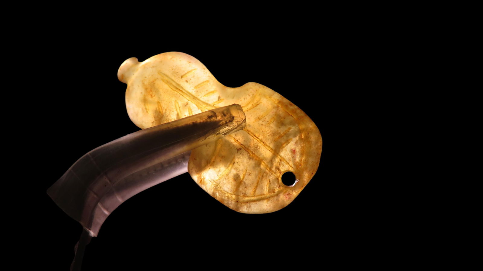 Translucent and Enscribed Jade Pendant Found in China: Translucent and Enscribed Jade Pendant Found in China