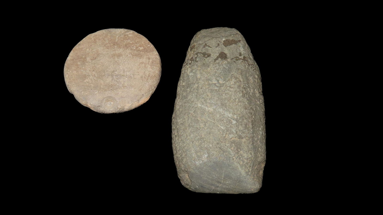 Lot of 2 Items, 1 5/8 unfinished pottery pendant, the other item is a celt measuring 2 7/8" (1 of 3)