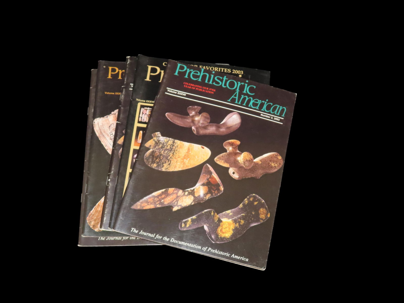 Group of 5. Prehistoric American. Volume XXXVII. Number 1 - 4, 2003. -- Two copies of Number 2 (1 of 3)