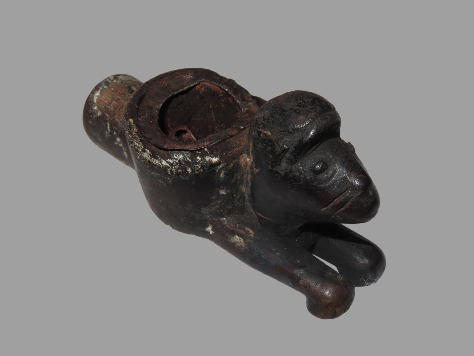 2 3/4" Animal Effigy Pipe, Northern Plains, Motley COA. Rare Historic Example made from wood with a: 2 3/4" Animal Effigy Pipe, Northern Plains, Motley COA. Rare Historic Example made from wood with a metal insert in the bowl. Heavy age & patina. Very neat old pipe!