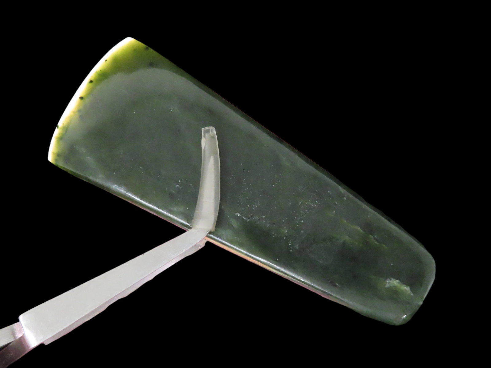 Incredible 4" Translucent Jade Mayan Celt, Guatemala. Motley COA. Great form and incredible polish.: Incredible 4" Translucent Jade Mayan Celt, Guatemala. Motley COA. Great form and incredible polish. Nice sharp bit and squared edges. Beautiful translucent green jade!