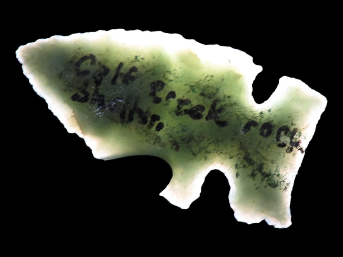 Incredible Green Side Notch Birdpoint found at the Calf Creek Rock Shelter, Searcy County Arkansas,: Incredible Green Side Notch Birdpoint found at the Calf Creek Rock Shelter, Searcy County Arkansas, Beautiful Vibrant Translucent Green Material. Ex Joey Ellis Collection.