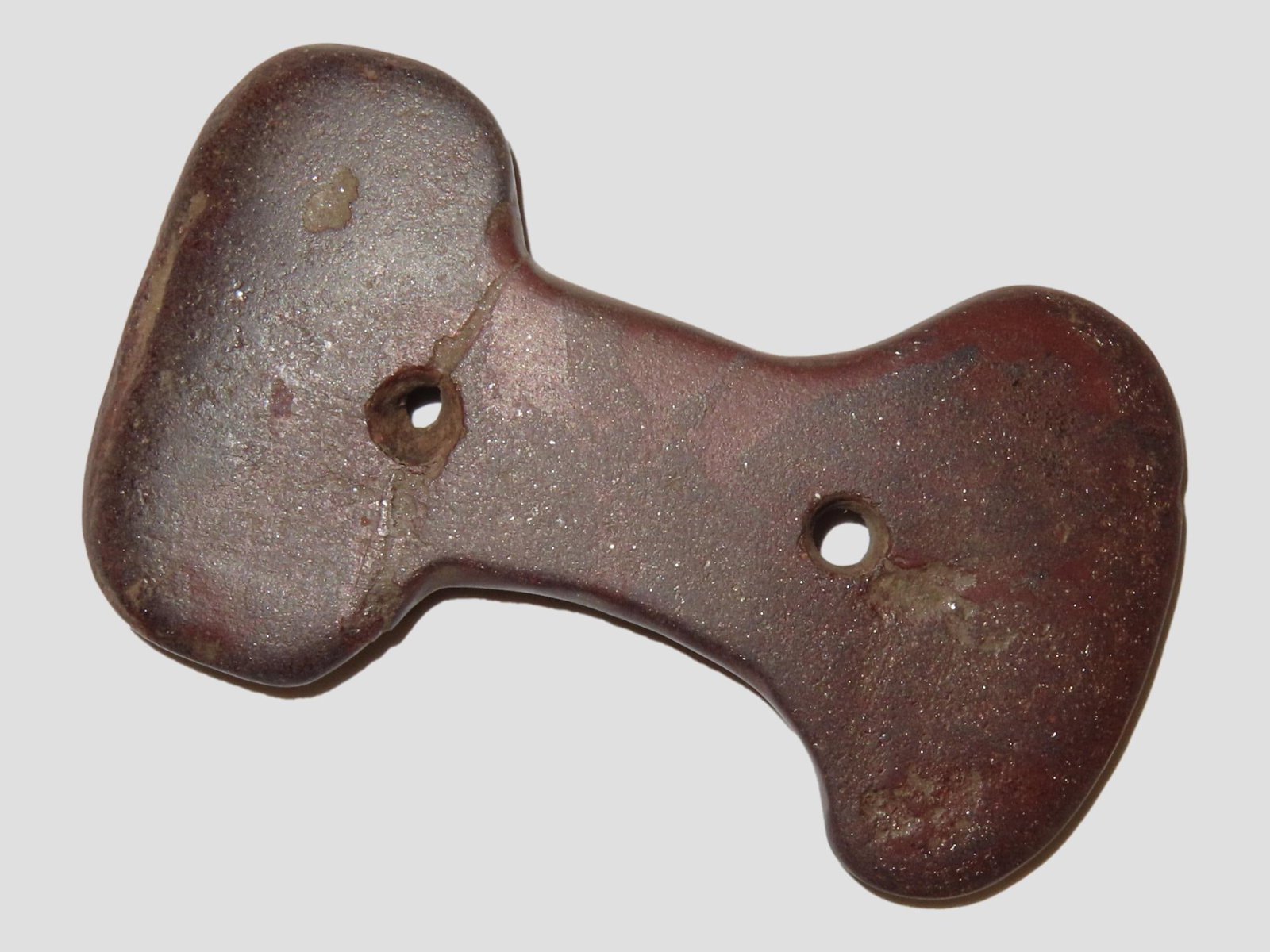 Amazing 2 7/8" Constricted Center Gorget found in Hardin County Tennessee. Made from a well polished: Amazing 2 7/8" Constricted Center Gorget found in Hardin County Tennessee. Made from a well polished Red & Purple Hematite or Ironstone. Broken and glued tightle at one hole.