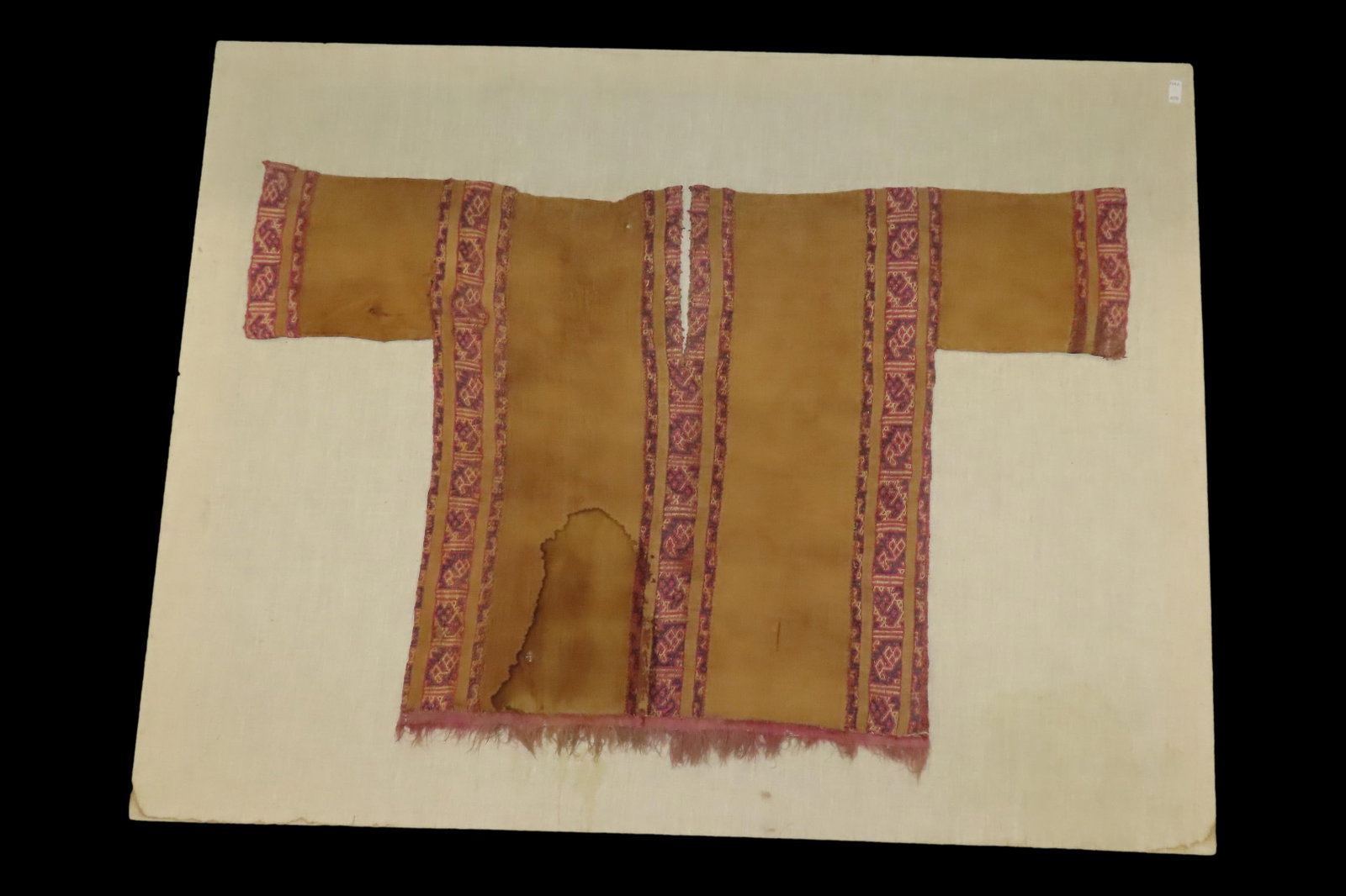 Rare Pre-Columbian Inca / Nazca Original Fabric Shirt, custom mounted on 40" x 31" frame. Nice rare: Rare Pre-Columbian Inca / Nazca Original Fabric Shirt, custom mounted on 40" x 31" frame. Nice rare artifact. Recovered in Peru.