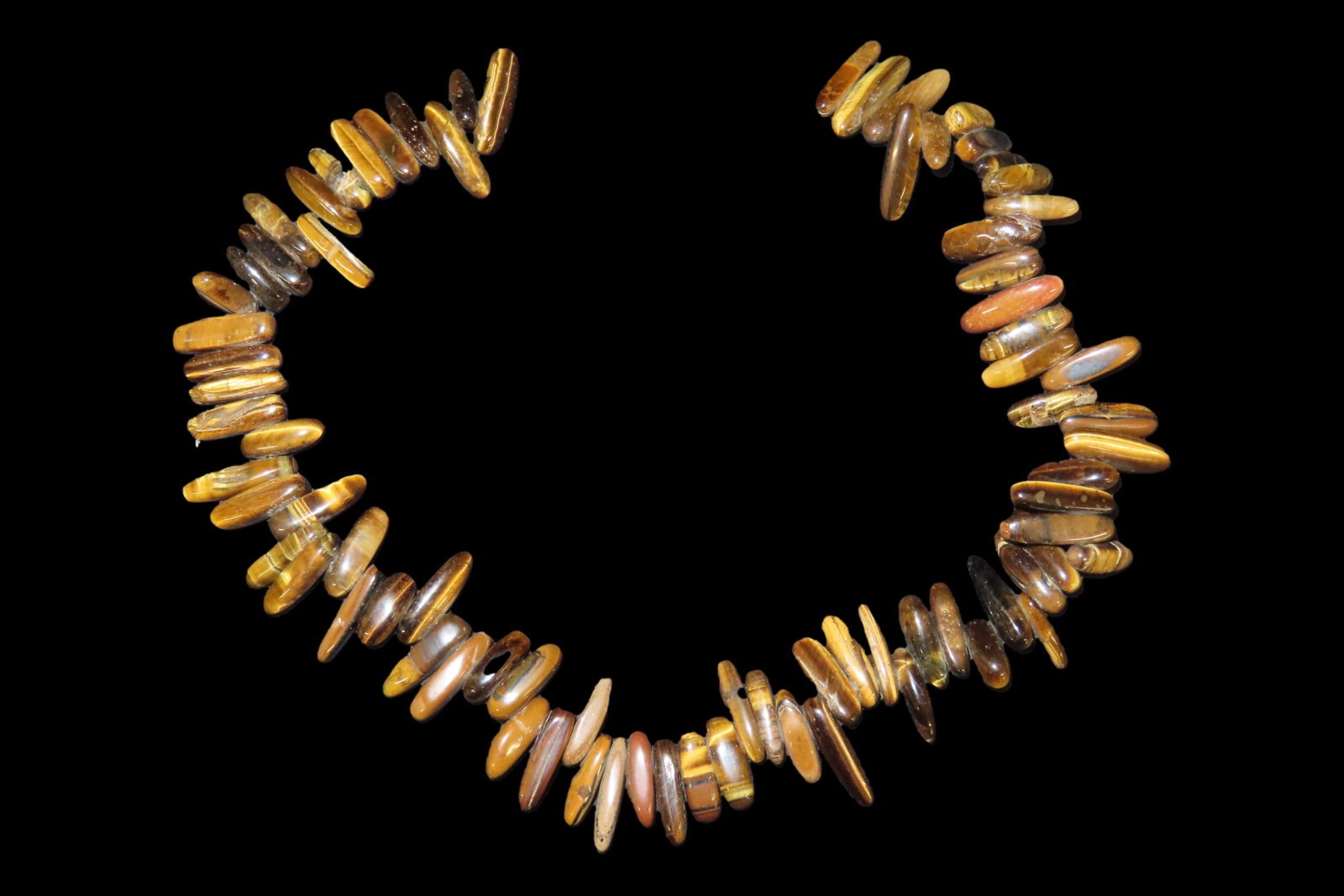 Vintage 16" Strand of Irredescent Tiger Eye Beads / Pendants. 70-80 Pieces, very colorful, all fully: Vintage 16" Strand of Irredescent Tiger Eye Beads / Pendants. 70-80 Pieces, very colorful, all fully polished and drilled.