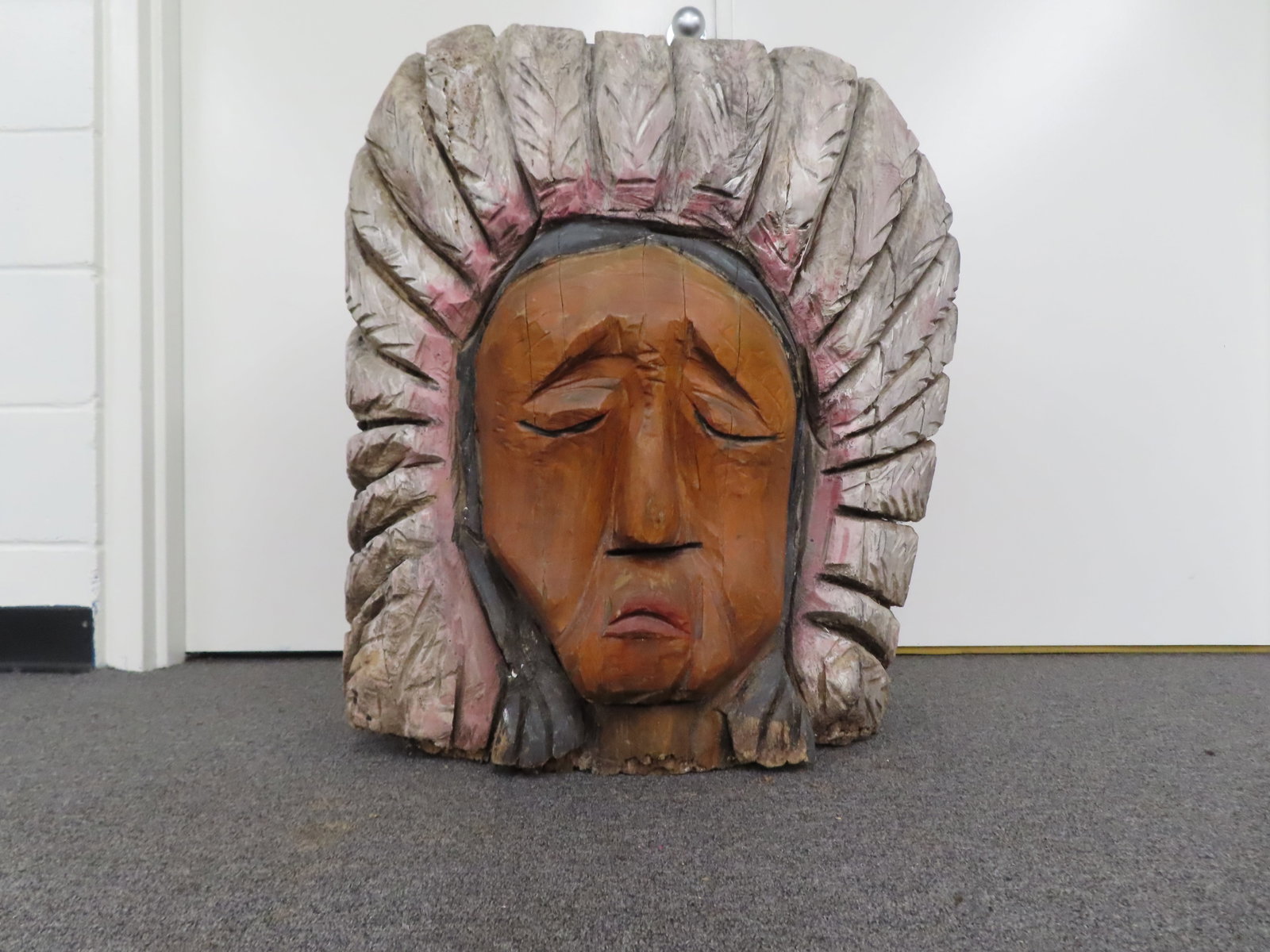 Vintage folk art wood carving depicting a Native American chief or warrior wearing a feathered war (1 of 9)