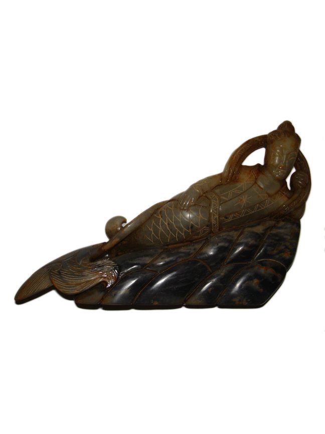 Ming Dynasty Jade Reclining Mermaid Sea Maiden: This exquisite mutton fat jade sea maiden with serene expression with flowing scarf, reclining on waves, is possibly from the Ming Dynasty (1368 to 1644 ce) or early Qing Dynasty (1644 to 1912 ce). Th