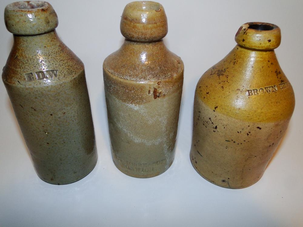 GROUPING OF THREE STONEWARE BOTTLES (1 of 4)