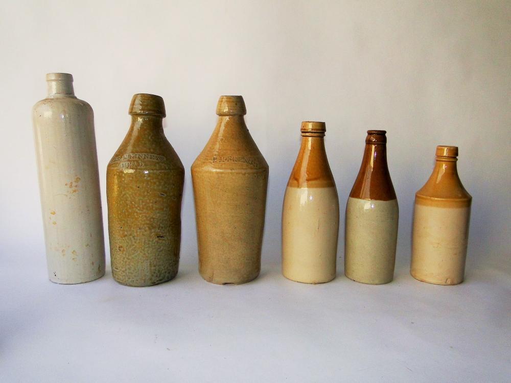 GROUPING OF SIX STONEWARE BOTTLES: GROUPING OF SIX 19TH CENTURY STONEWARE BOTTLES