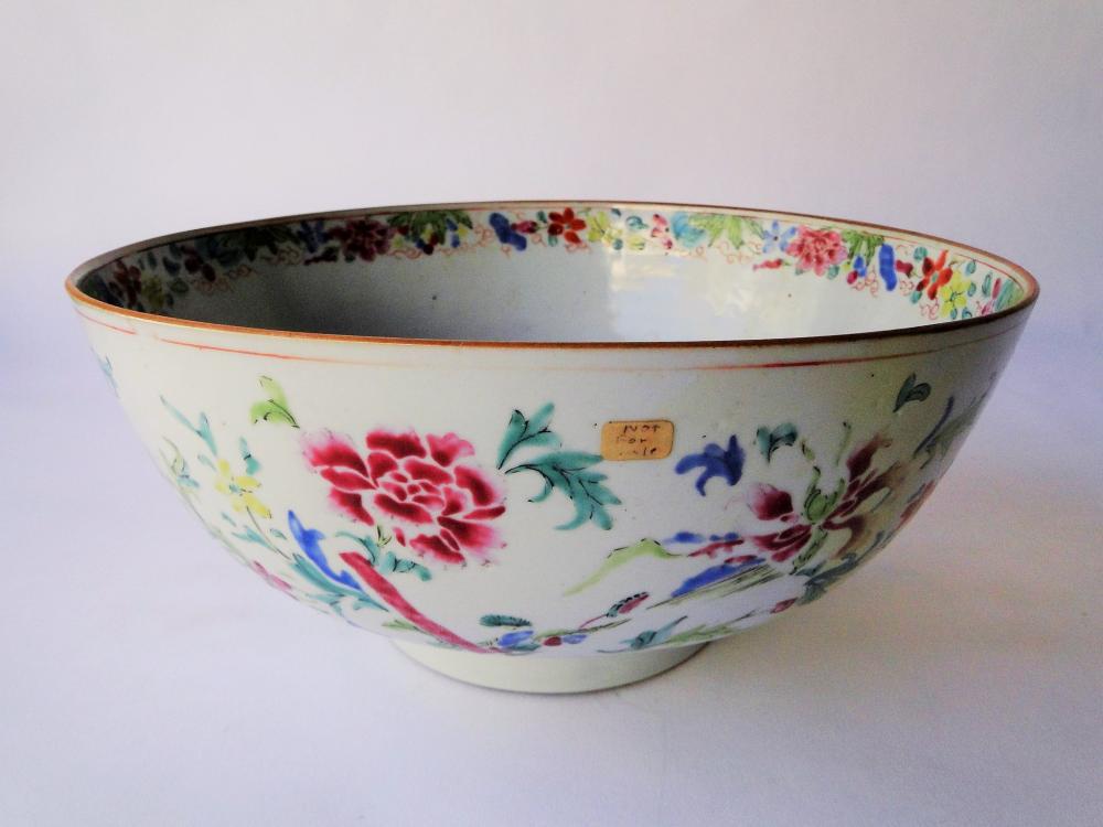 C. 1721 EXPORT PORCELAIN PUNCH BOWL ALBERT SACK: C. 1721 EXPORT PORCELAIN PUNCH BOWL WITH FLORAL DECORATION. FROM THE ESTATE OF ALBERT SACK. TAGGED ON THE BOTTOM "SACK" AND "NOT FOR SALE". IT WAS MOST LIKELY A SHOP PROP. 10.5 X 4.5, RESTORED.