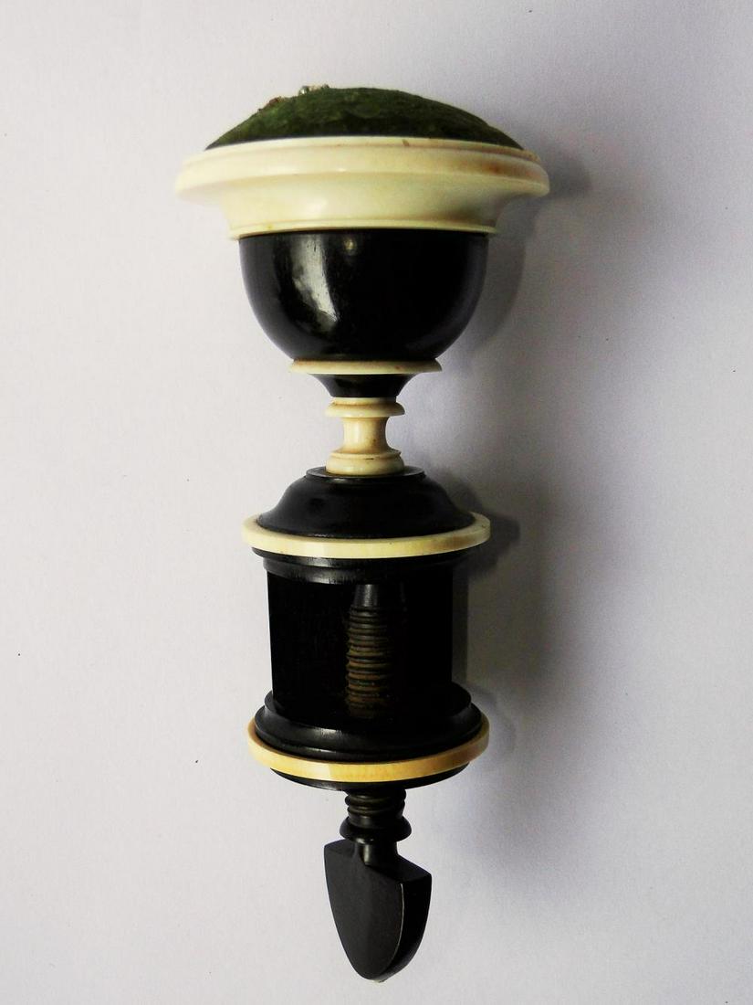 EARLY EBONY AND BONE PIN CUSHION: EARLY EBONY AND BONE PIN CUSHION ON MOUNTING SCREW, 7"