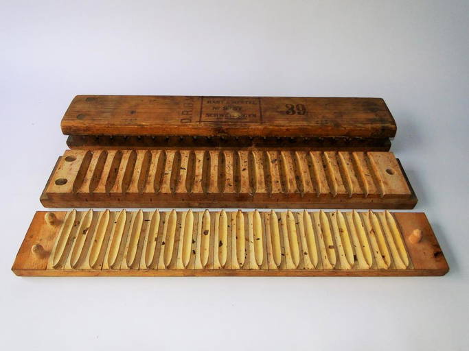 Two Carved Cigar Molds