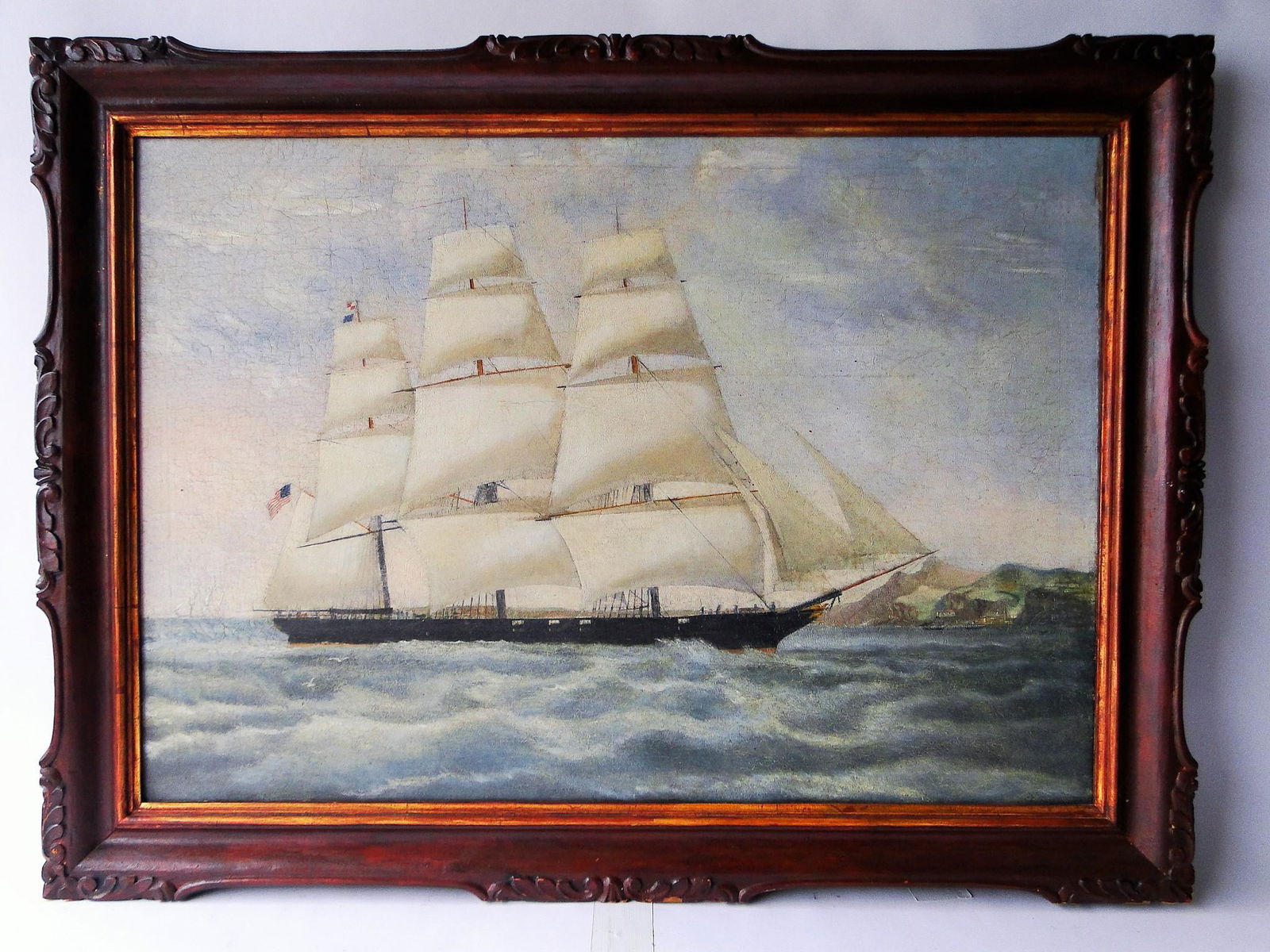 LARGE OIL PAINTING OF AN AMERICAN SHIP, FLYING THE: LARGE OIL PAINTING OF AN AMERICAN SHIP, FLYING THE AMERICAN FLAG, ORIGINAL FRAME, 28 X 38
