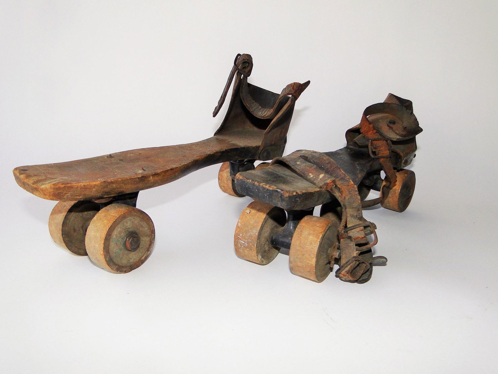 C. 1880'S WOODEN ROLLER SKATES (1 of 2)