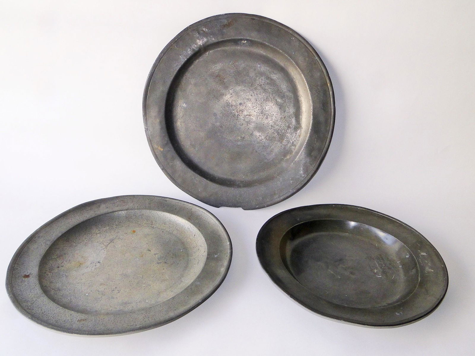 GROUPING OF THREE PEWTER CHARGERS (1 of 4)