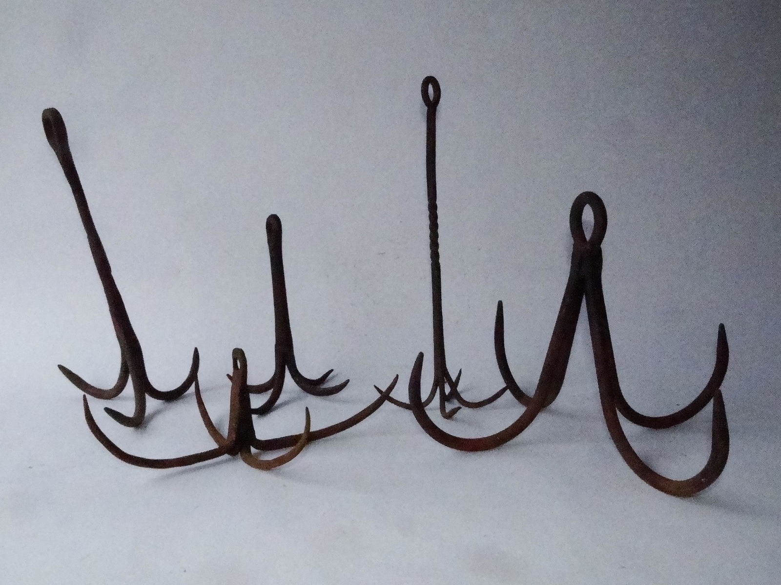 GROUPING OF FIVE IRON GAME HOLDERS (1 of 2)