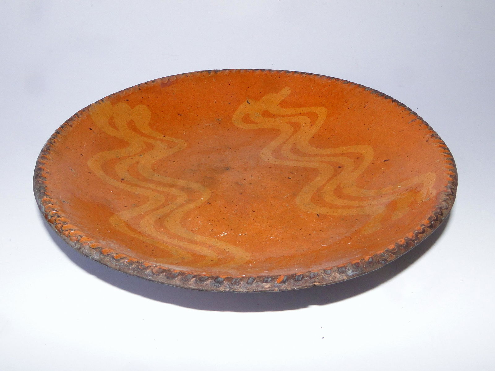 EARLY DECORATED REDWARE PLATE (1 of 2)