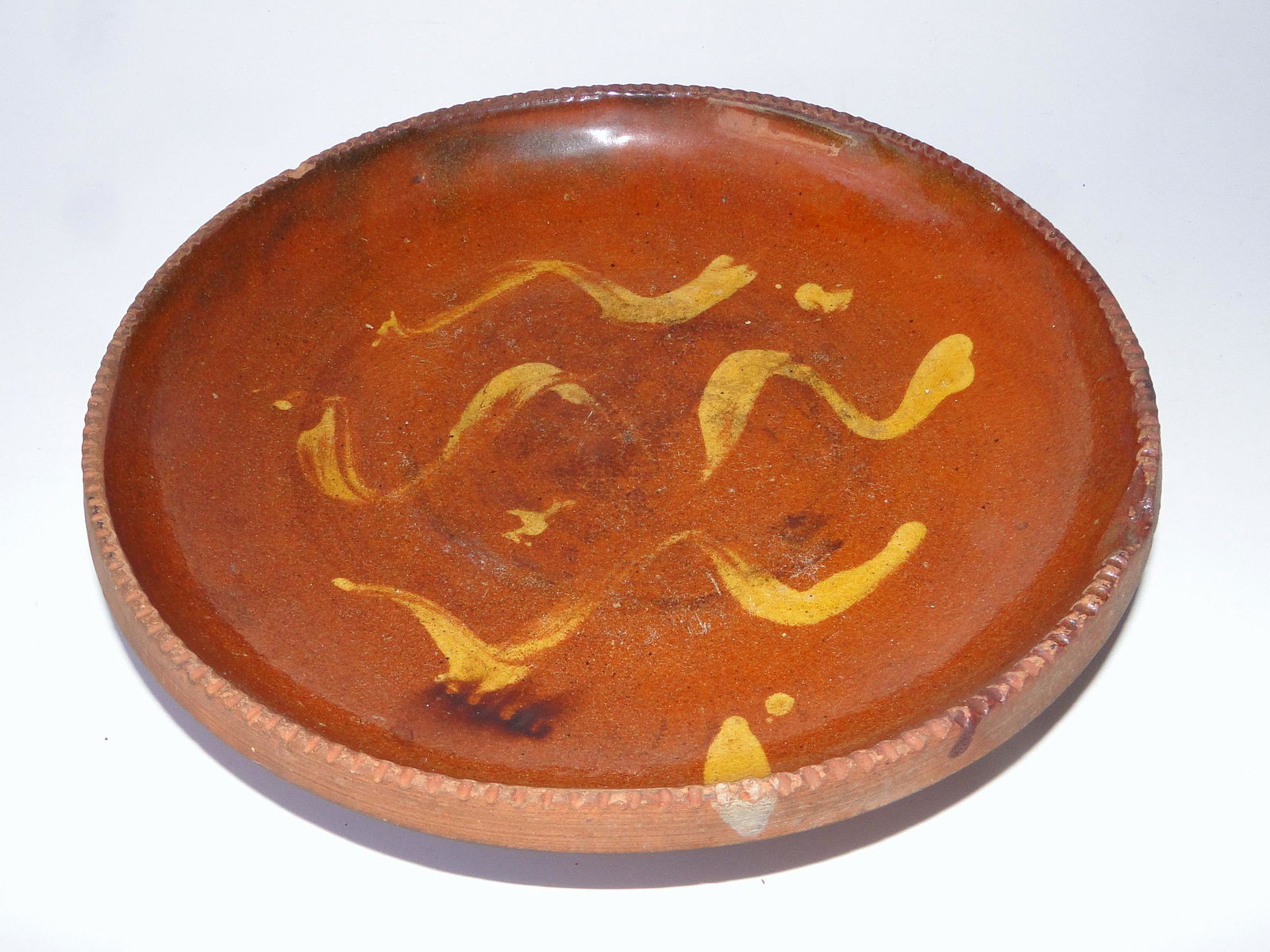 DECORATED REDWARE PLATE: DECORATED REDWARE PLATE, 9", TINY CHIP