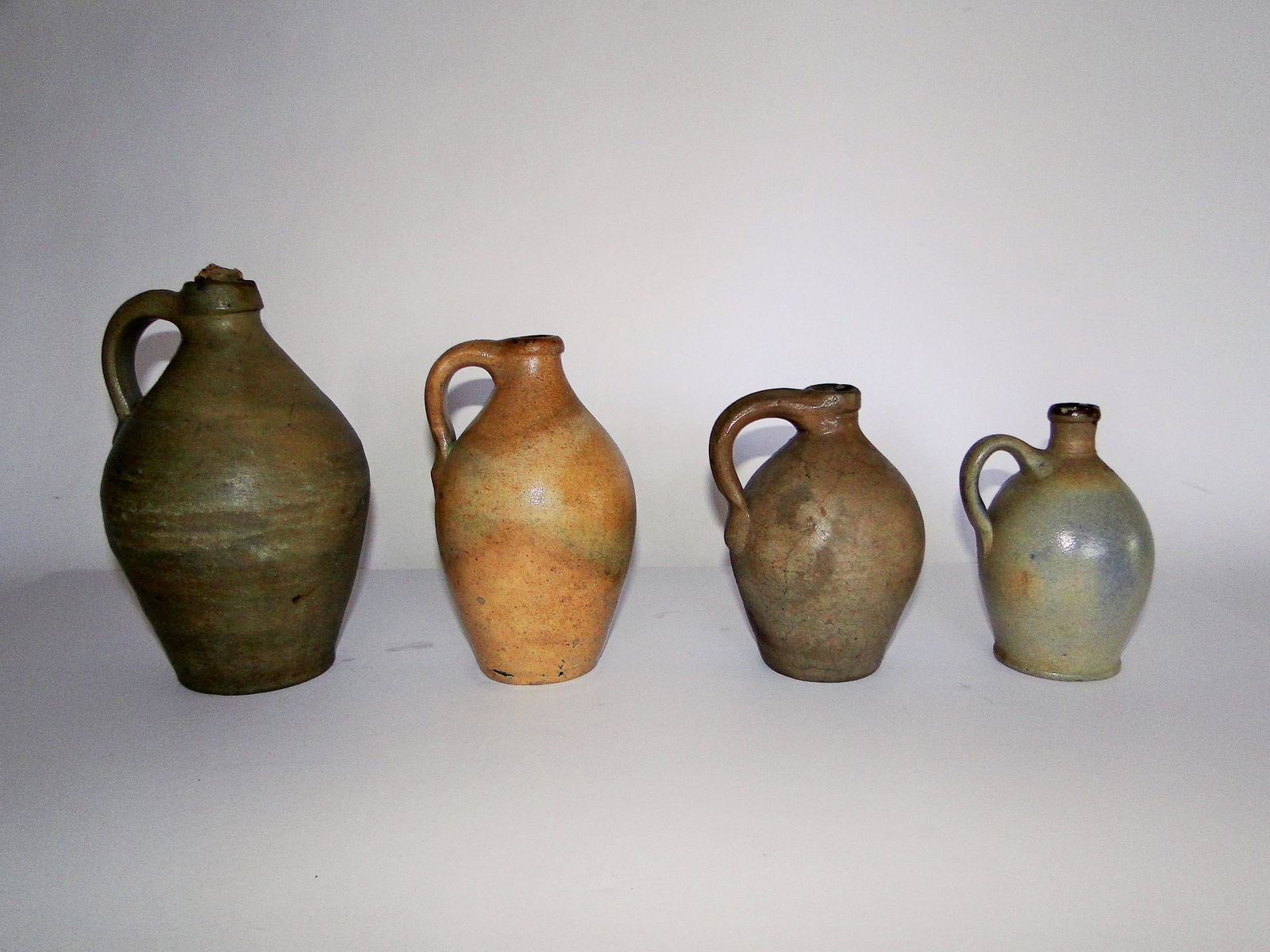GROUPING OF SMALL STONEWARE OVOID JUGS (1 of 2)
