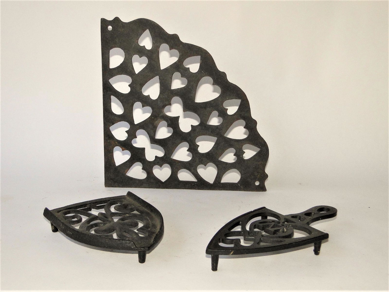 GROUPING OF IRON HEART , TRIVETS (1 of 1)