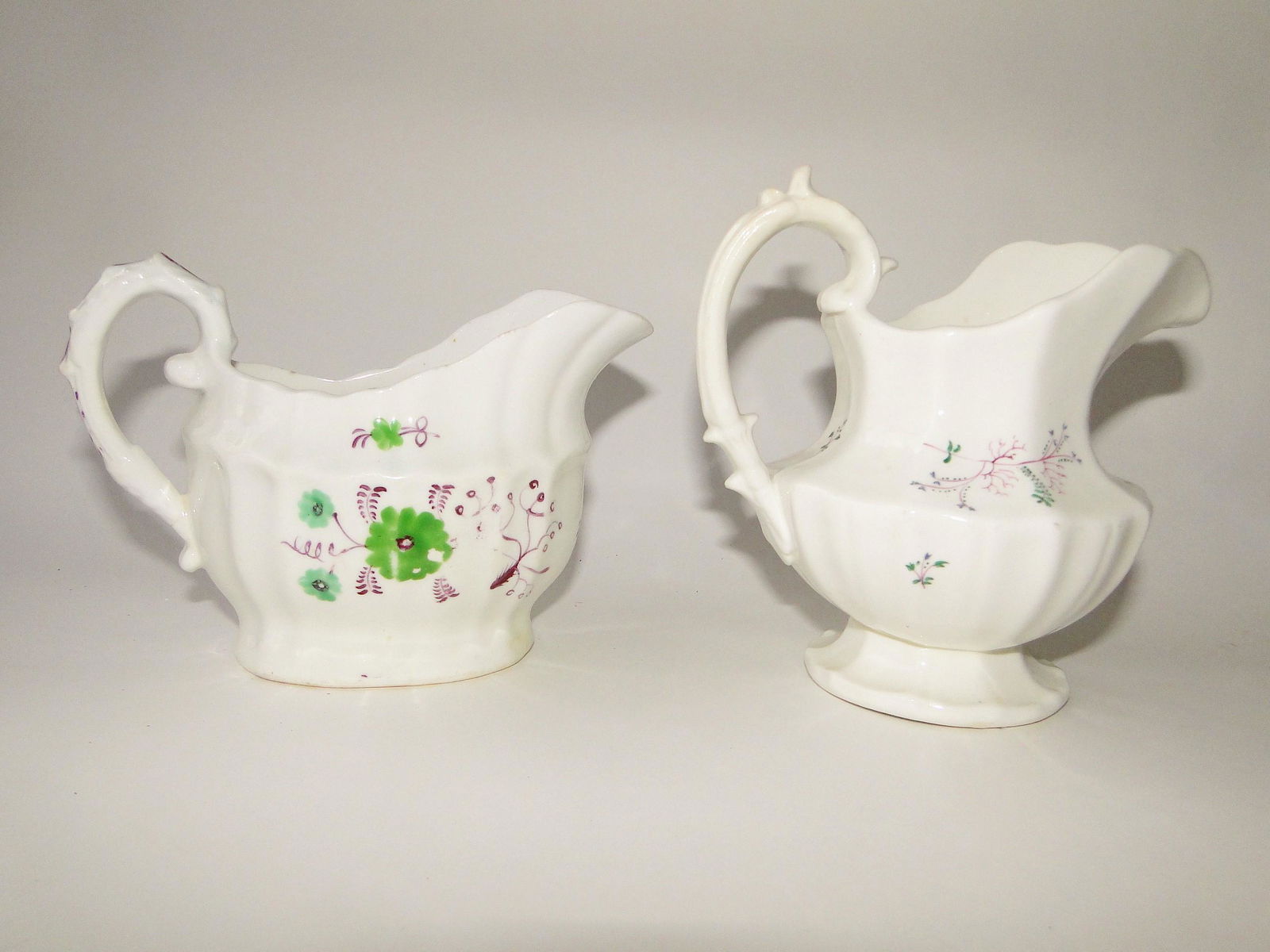 C. 1825 TWO SOFT PASTE SPRIG PATTERN CREAMERS (1 of 2)