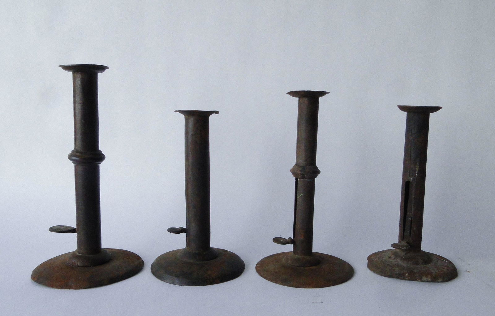 GROUPING OF HOGSCRAPER CANDLESTICKS (1 of 3)