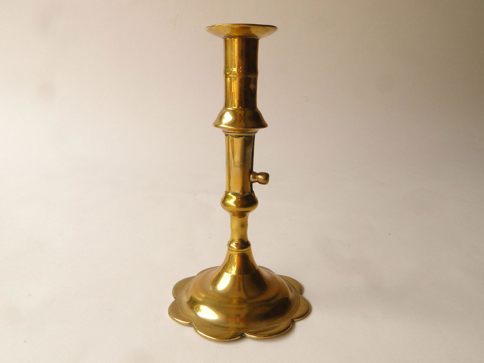 18TH C QUEEN ANNE PETAL BASE CANDLESTICK (1 of 3)