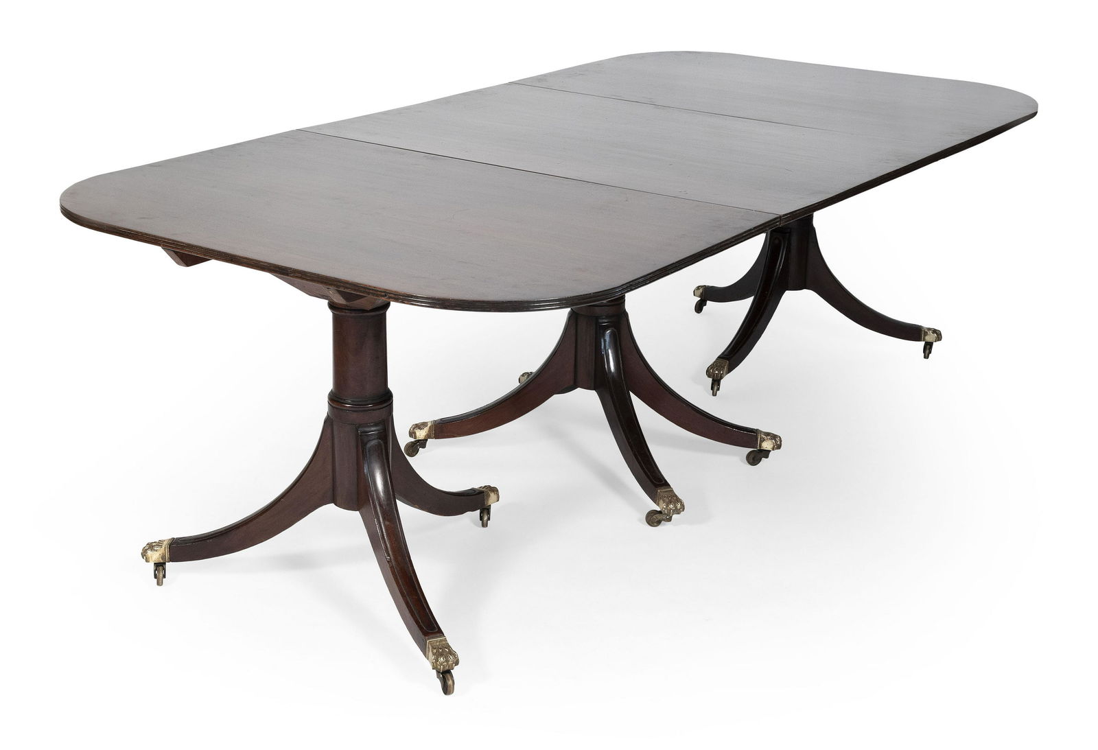 DUNCAN PHYFE-STYLE TRIPLE-PEDESTAL DINING TABLE: DUNCAN PHYFE-STYLE TRIPLE-PEDESTAL DINING TABLE MAHOGANY, BRASS LION PAW FEET, CASTORS, 28.5 X 94.5 X 48, SURFACE SCRATCHES, REPAIRED PEDESTAL, TWO LEGS.