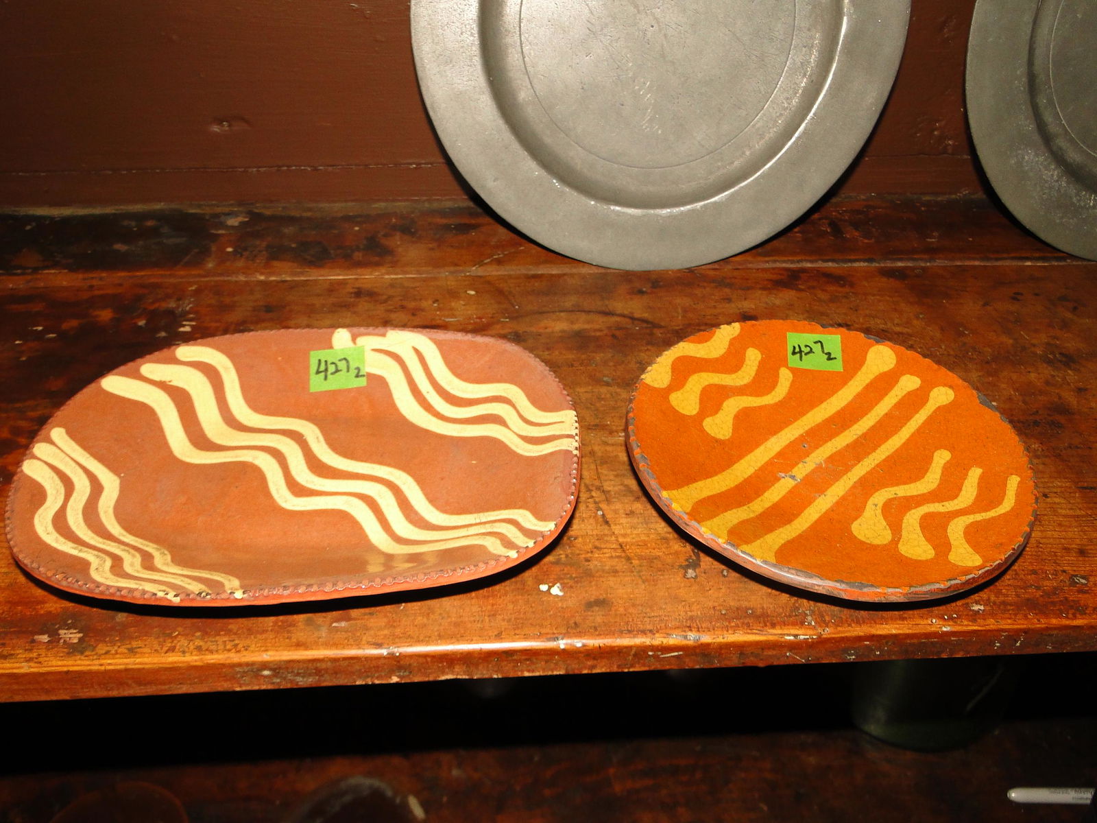 TWO DECORATED REDWARE PLATES (1 of 3)