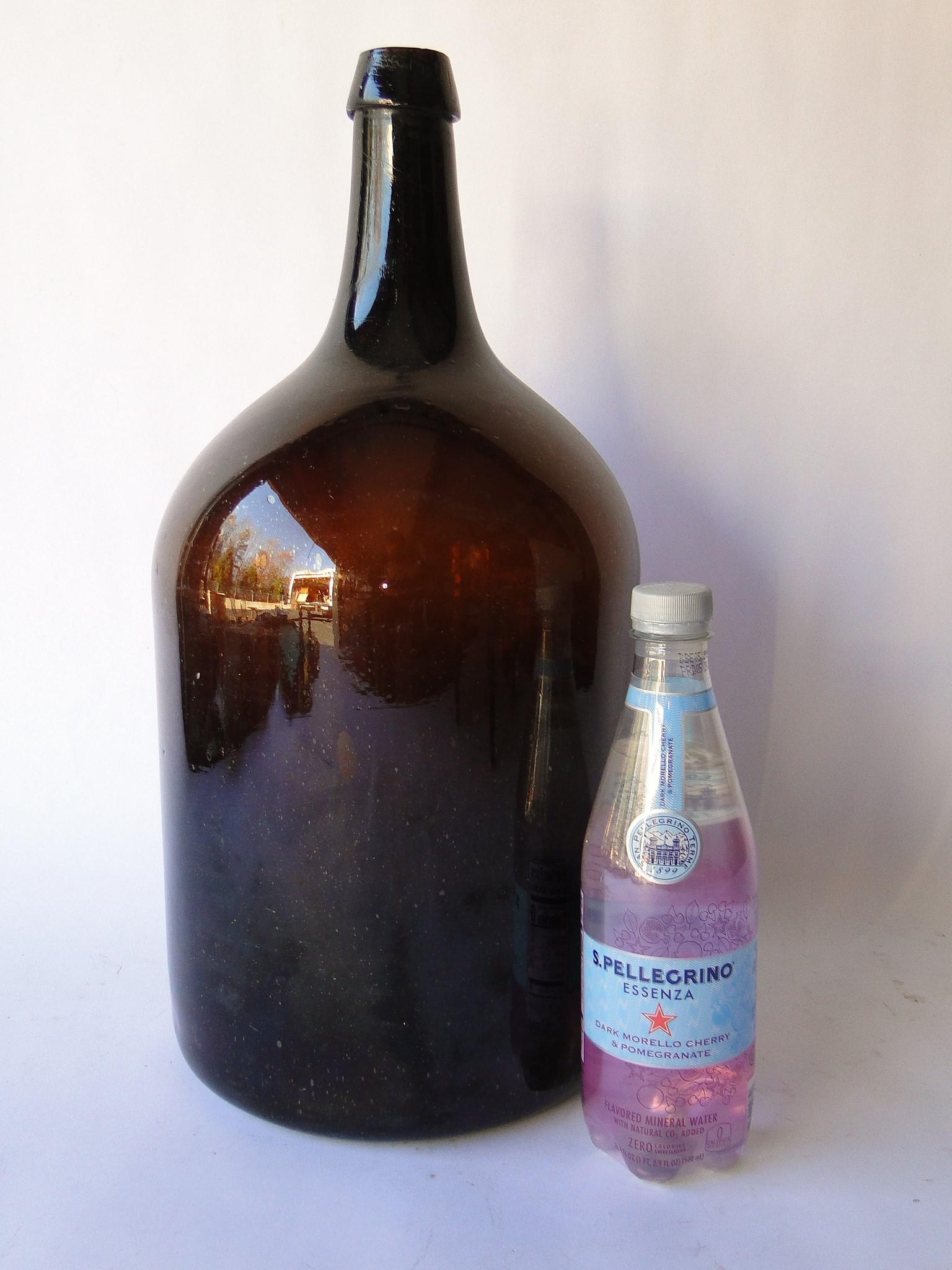 LARGE BLOWN AMBER GLASS BOTTLE (1 of 3)
