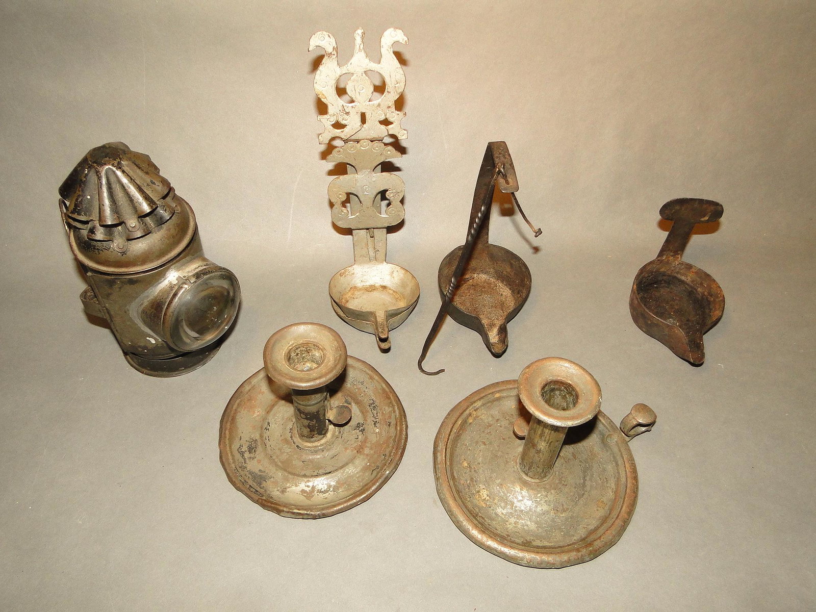 GROUPING OF 19TH C LIGHTING: GROUPING OF 19TH C LIGHTING, TWO TIN CHAMBER STICKS, THREE BETTY LAMPS, ONE WHALE OIL LANTERN