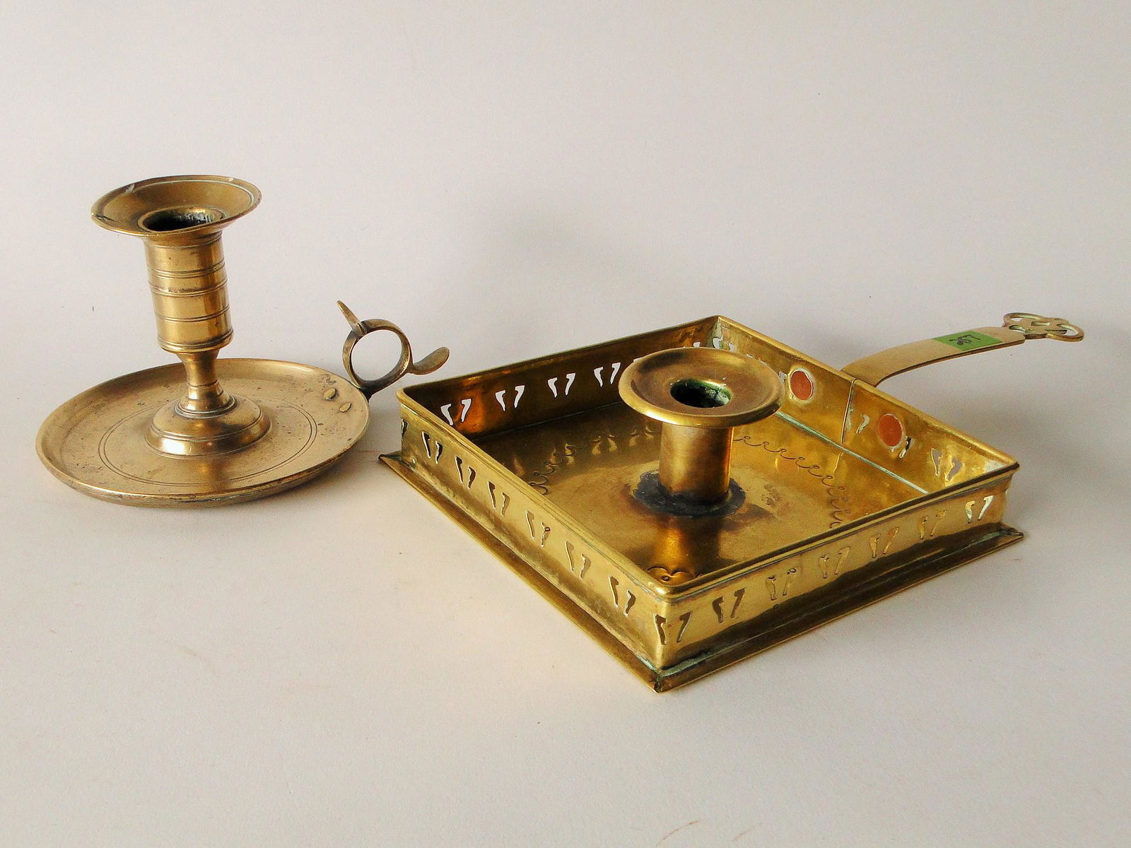 TWO EARLY 18TH C  BRASS CANDLE DISHES (1 of 1)
