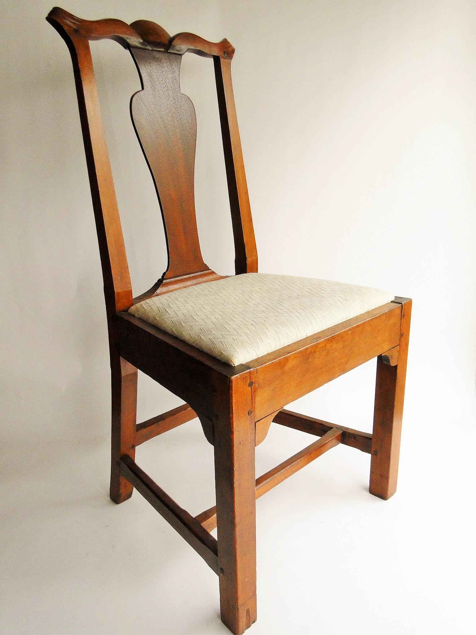 UNUSUAL CAPE COD COUNTRY CHIPPENDALE CHAIR: UNUSUAL CAPE COD COUNTRY CHIPPENDALE CHAIR CIRCA 1760-1770, CARVED CREST, FRONT SIDE BRACKETS UNDER SEAT, MAPLE CIRCA 1770, UPHOLSTERED INSET SEAT, 38 X 18 SEAT,