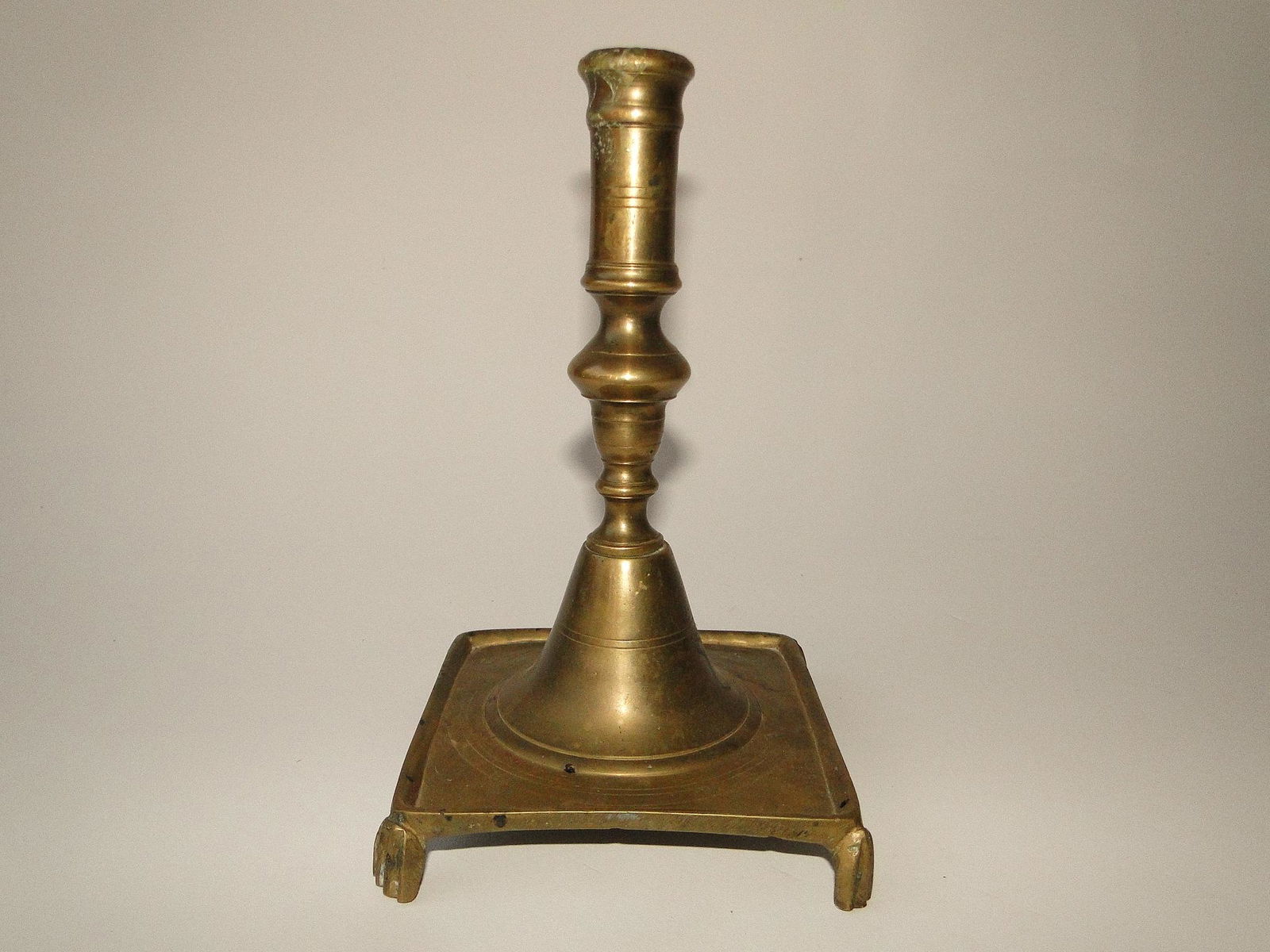 EARLY SQUARE BASE BRASS CANDLESTICK (1 of 2)