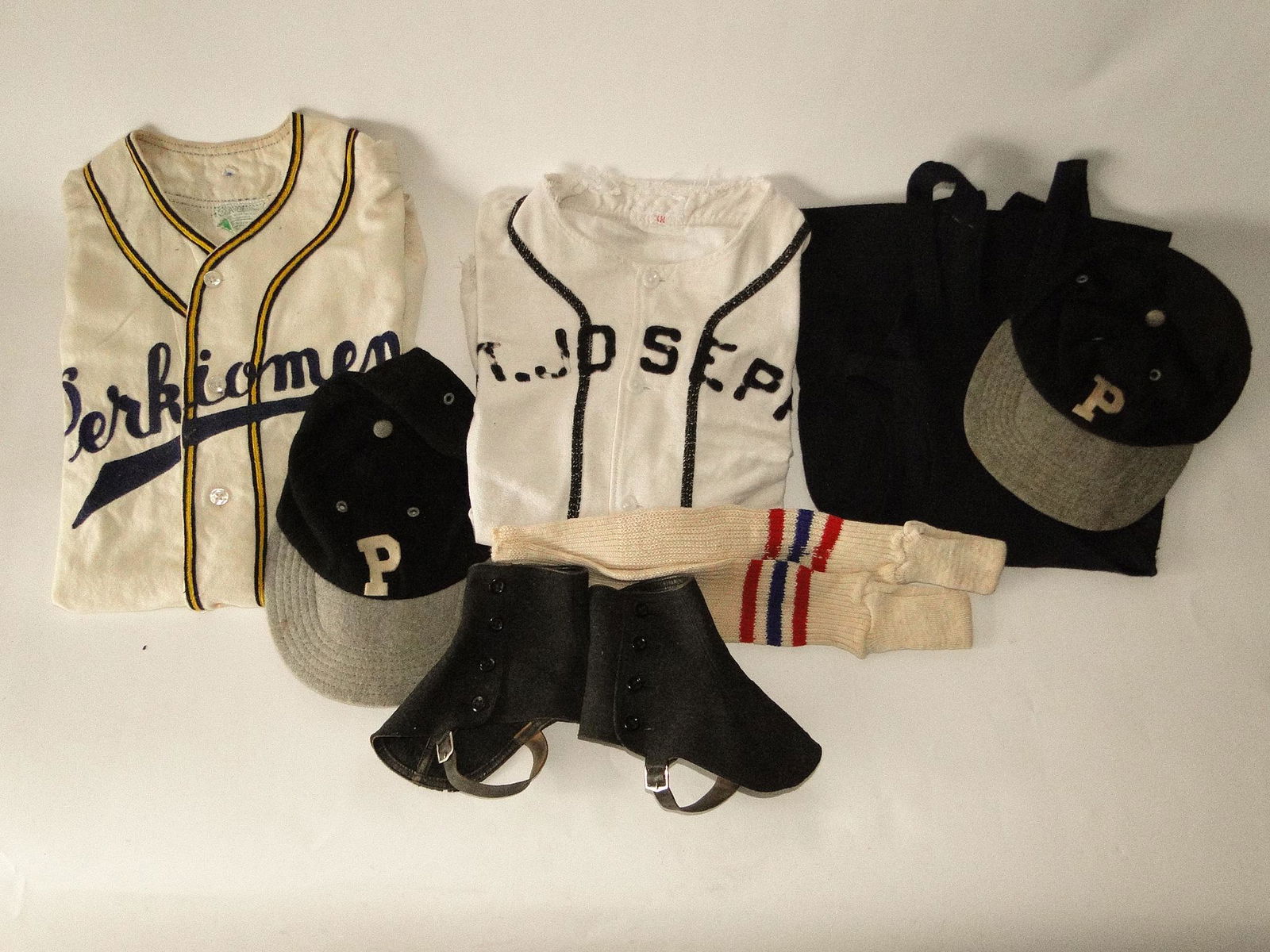 GROUPING OF SPORTS UNIFORMS AND CAPS (1 of 3)