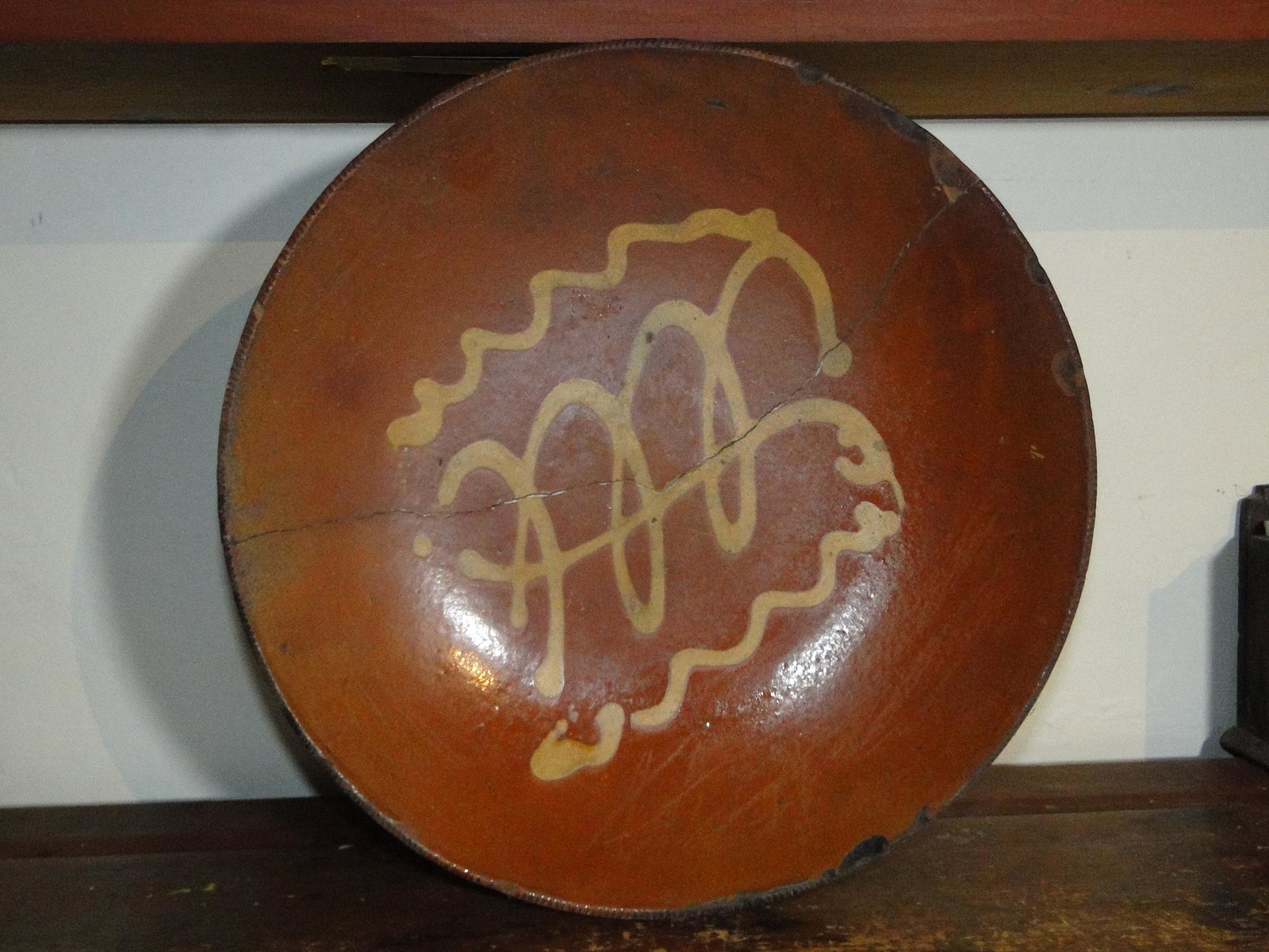 19TH C DECORATED REDWARE PLATE (1 of 2)