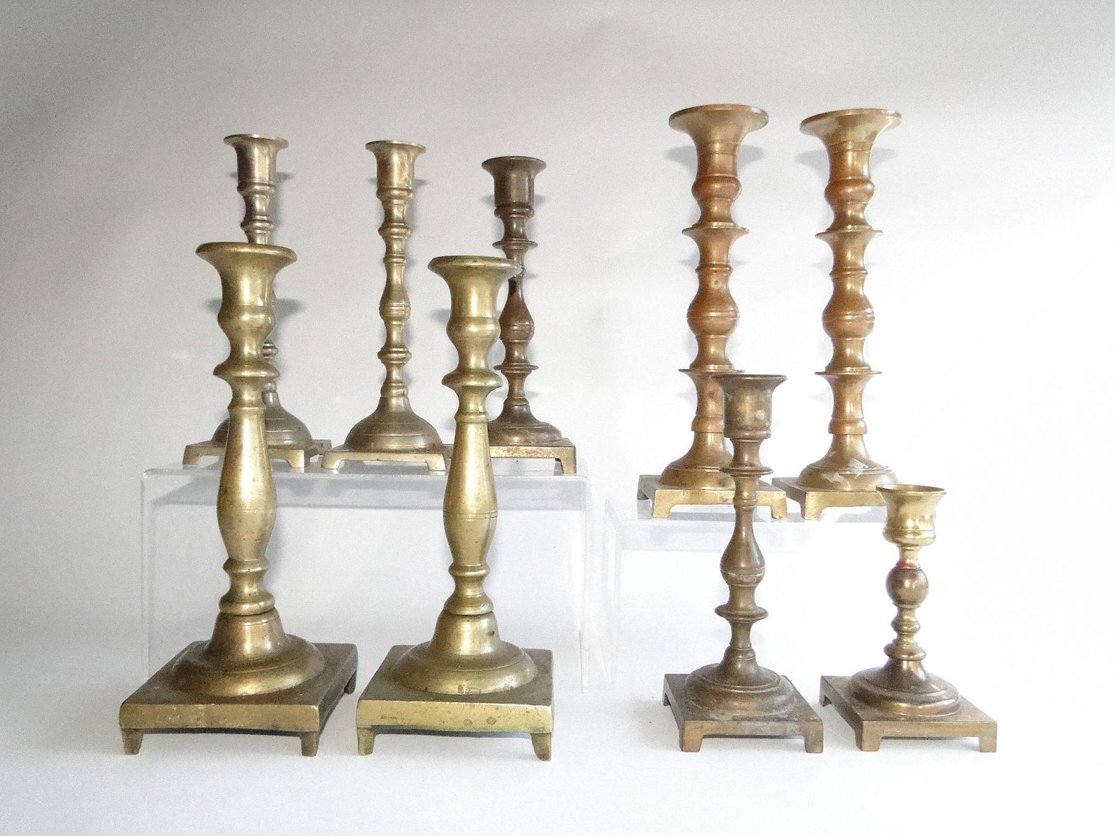 LARGE GROUPING OF BRASS CANDLESTICKS (1 of 3)